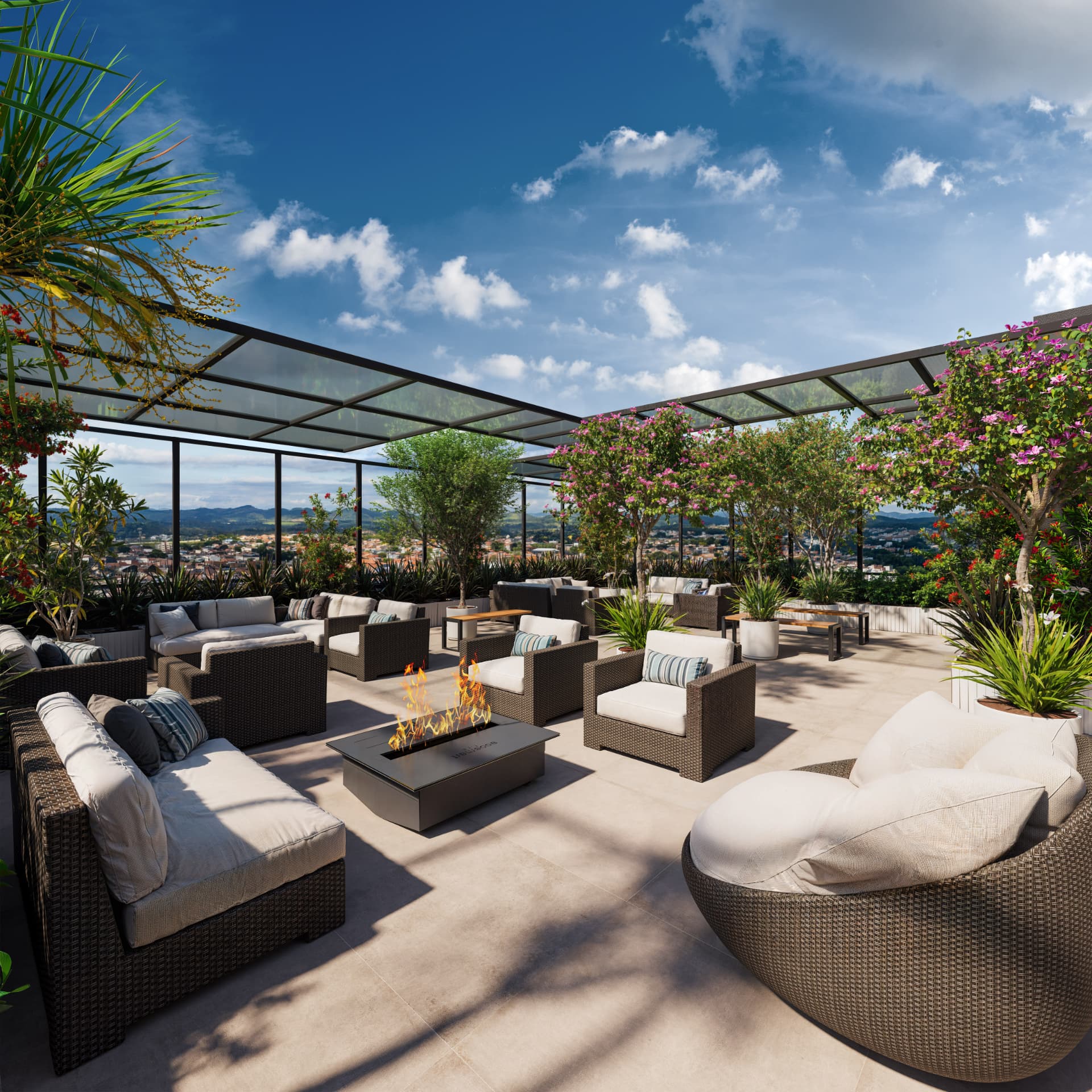 Lounge do rooftop do Sky Breeze com sofás de fibra, lareira ecológica e vista para a serra